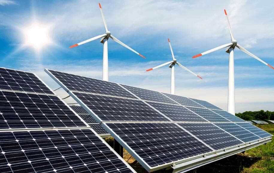 Solar panels and wind turbines in a renewable energy system